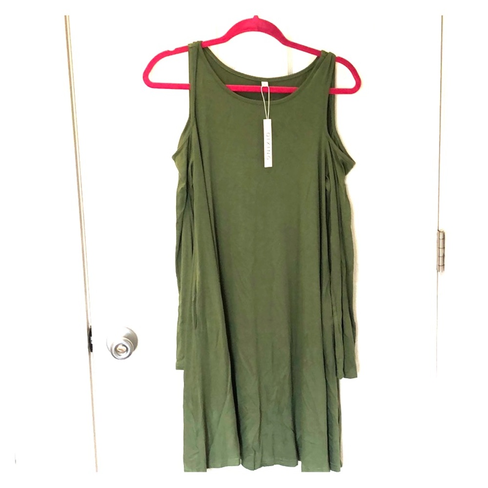 Peekaboo shoulder dress. Large, loose-fit, pockets
